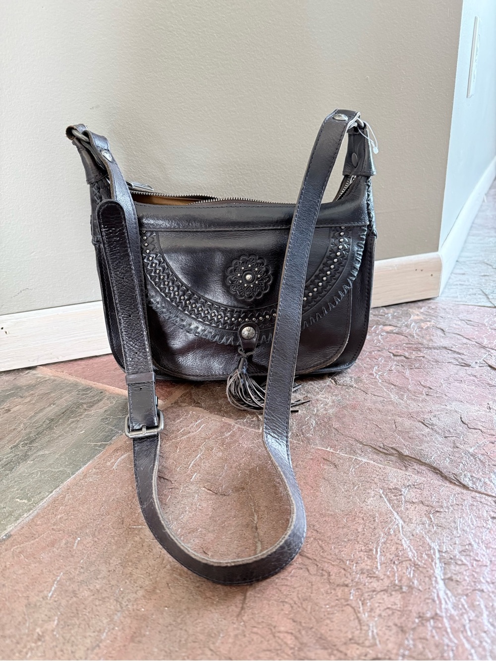 Black Leather Crossbody Saddle Bag with Tassel Accent -flawless